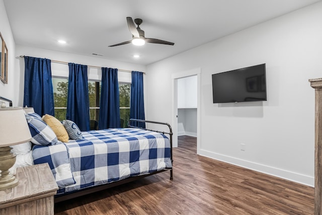 bedroom with hardwood / wood-style flooring and ceiling fan