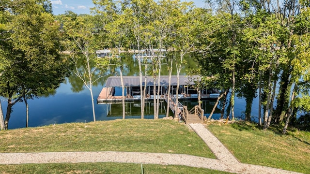 dock area featuring a yard and a water view