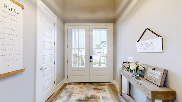 doorway to outside with french doors and light hardwood / wood-style flooring