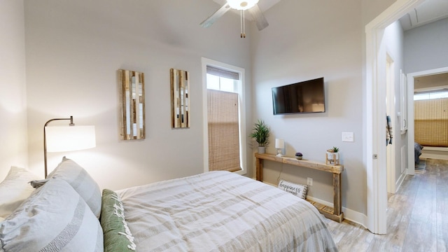 bedroom featuring light hardwood / wood-style flooring and ceiling fan