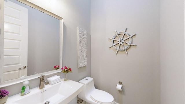 bathroom featuring sink and toilet