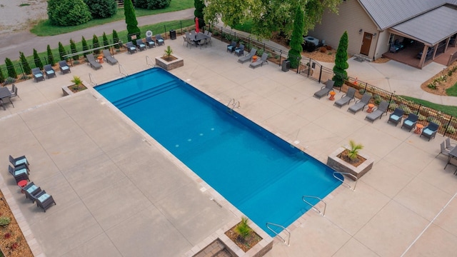 view of swimming pool with a patio