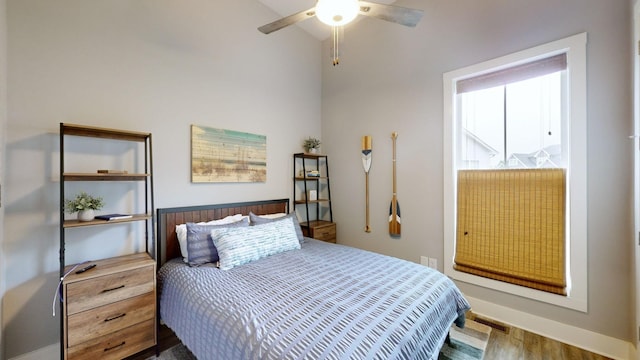 bedroom featuring hardwood / wood-style floors and ceiling fan