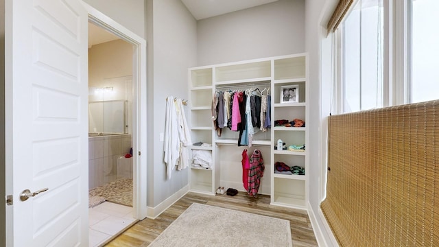 mudroom with light hardwood / wood-style floors