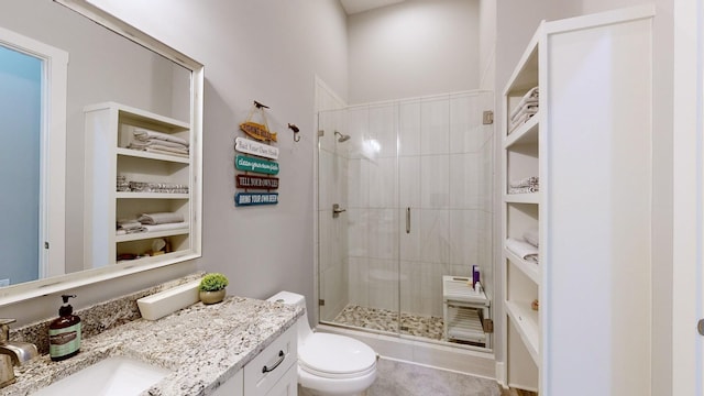 bathroom with vanity, toilet, and walk in shower