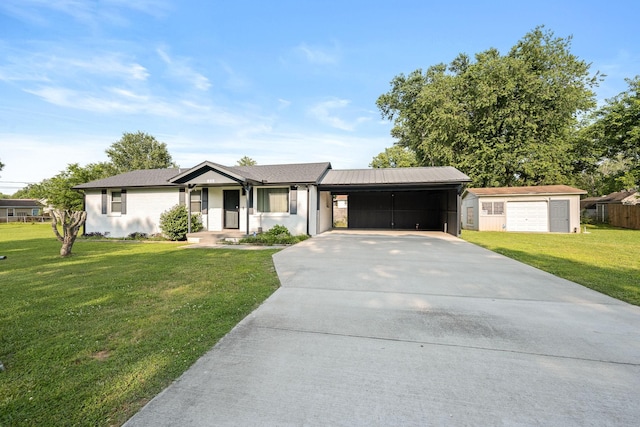 118 Markum Dr, La Vergne, TN 37086 - ranch-style house featuring concrete driveway, a front lawn, an attached carport, and an outdoor structure