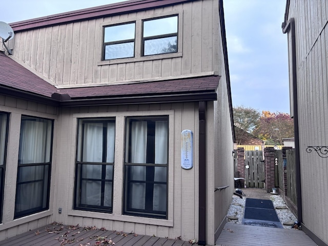 view of home's exterior featuring a wooden deck