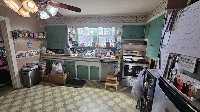 kitchen with electric stove, exhaust hood, green cabinetry, and ceiling fan