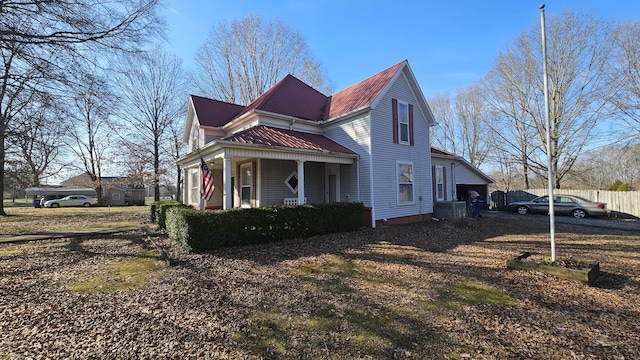 view of side of property featuring a porch