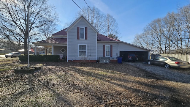 view of front of home featuring central AC and a garage