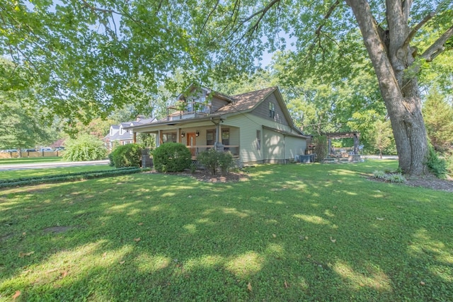 view of front of property with a pergola, a front yard, and a porch