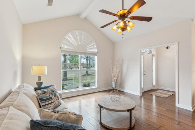 living room featuring hardwood / wood-style flooring, ceiling fan, and lofted ceiling with beams