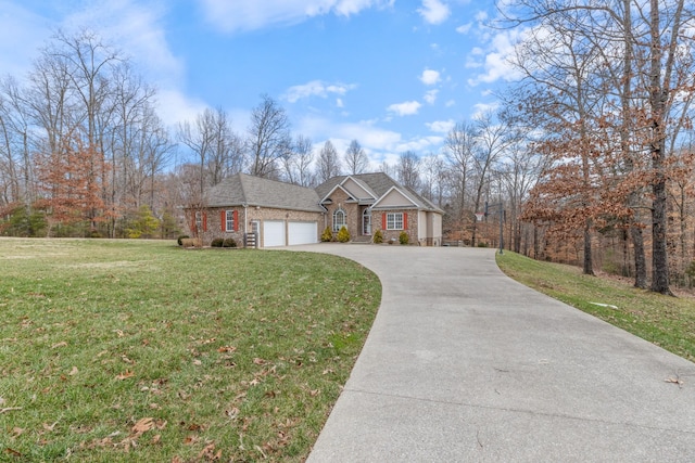 view of front of property with a front yard and a garage