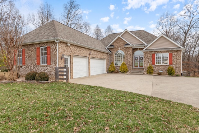 view of front of property with a front lawn and a garage