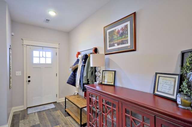 entryway with dark wood-type flooring