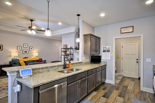 kitchen featuring sink, stainless steel dishwasher, kitchen peninsula, hanging light fixtures, and dark brown cabinets