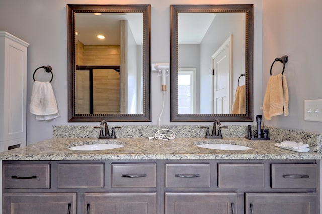 bathroom with vanity and walk in shower