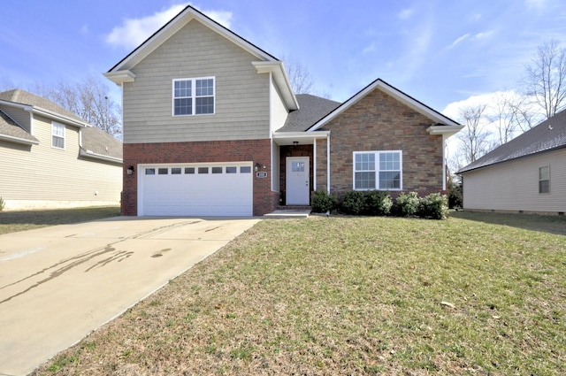 view of property featuring a front lawn and a garage