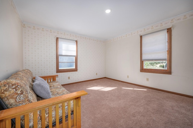 bedroom featuring baseboards, carpet flooring, and multiple windows