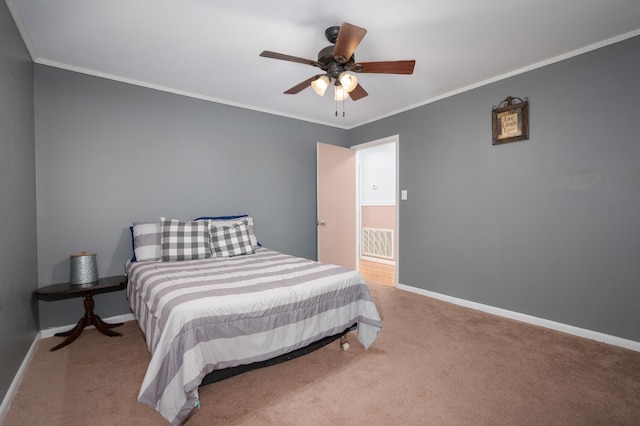 carpeted bedroom with baseboards, ornamental molding, ceiling fan, and visible vents