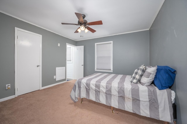 bedroom with carpet flooring, a ceiling fan, baseboards, and ornamental molding