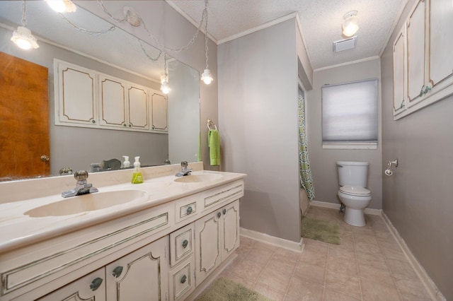 bathroom with double vanity, toilet, ornamental molding, and a sink
