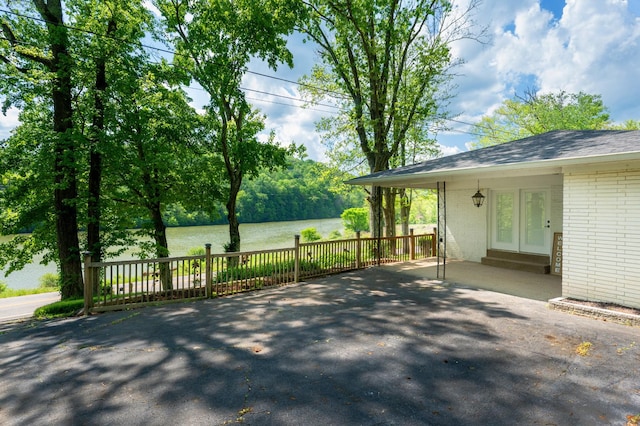 view of patio featuring a water view