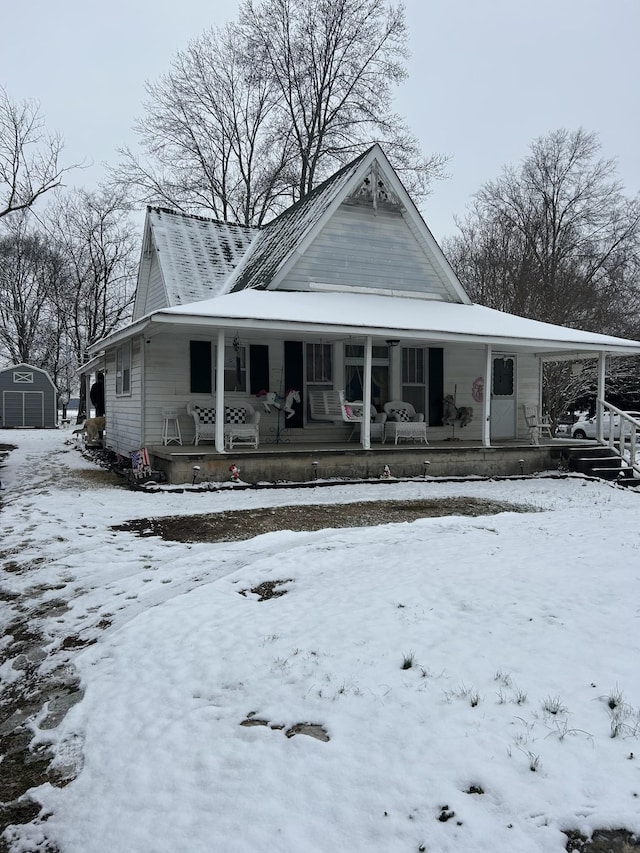 view of front facade featuring a porch and a garage