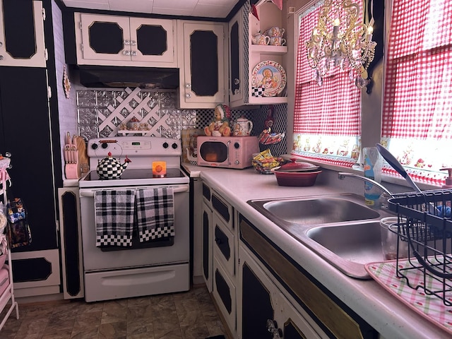 kitchen with a notable chandelier, a sink, light countertops, range hood, and white range with electric cooktop