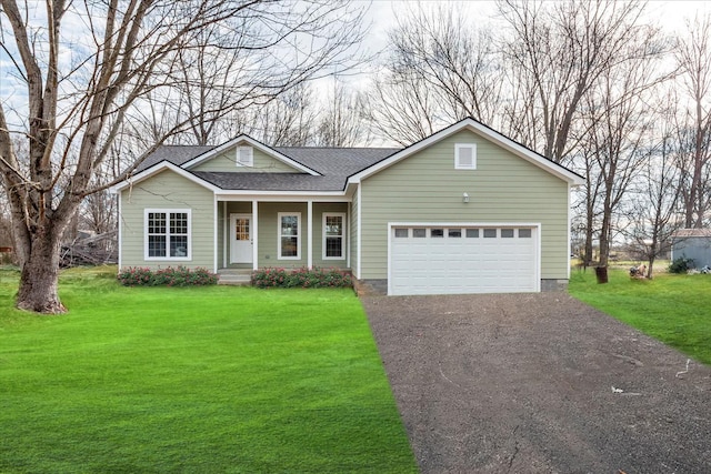 ranch-style house featuring driveway, a garage, a front lawn, and roof with shingles