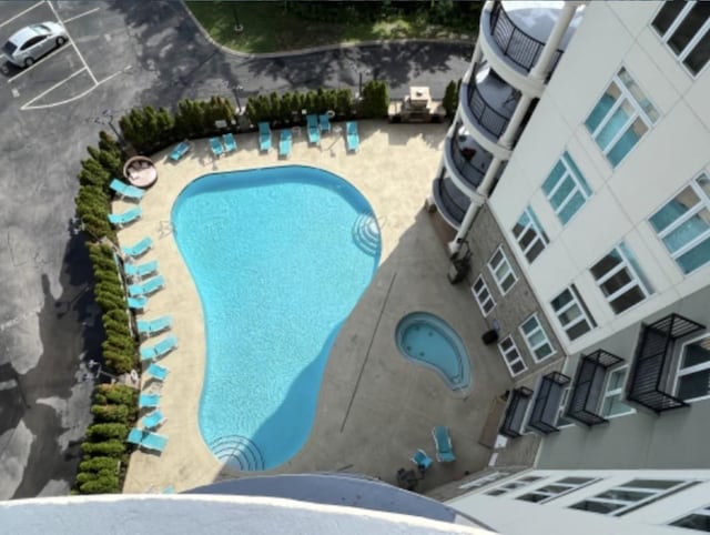 view of swimming pool with a patio area