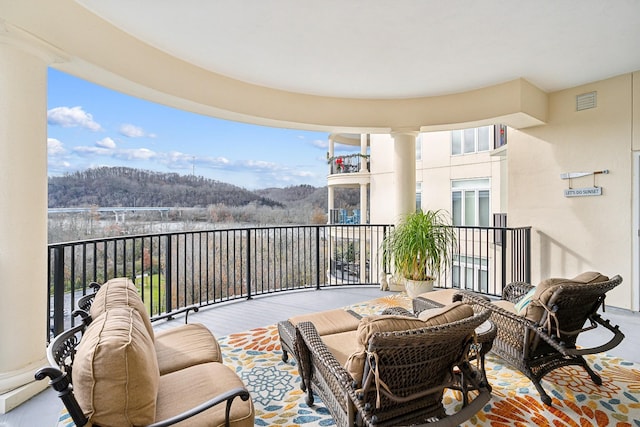 balcony featuring a mountain view