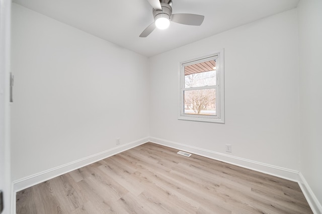 empty room featuring ceiling fan and light wood-type flooring