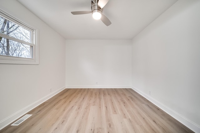 spare room featuring ceiling fan and light hardwood / wood-style flooring