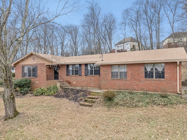 ranch-style house with a front lawn