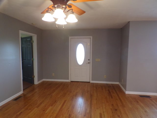 entryway with ceiling fan and light hardwood / wood-style flooring