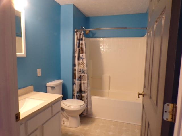 full bathroom featuring toilet, a textured ceiling, vanity, and shower / bath combination with curtain