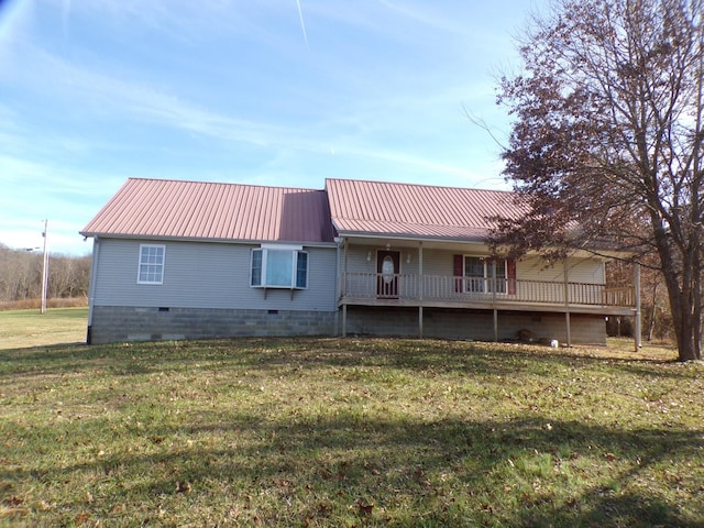 rear view of house with a lawn