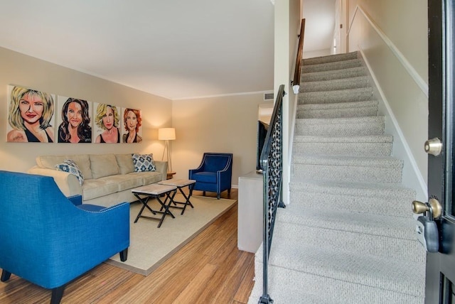 staircase with hardwood / wood-style floors