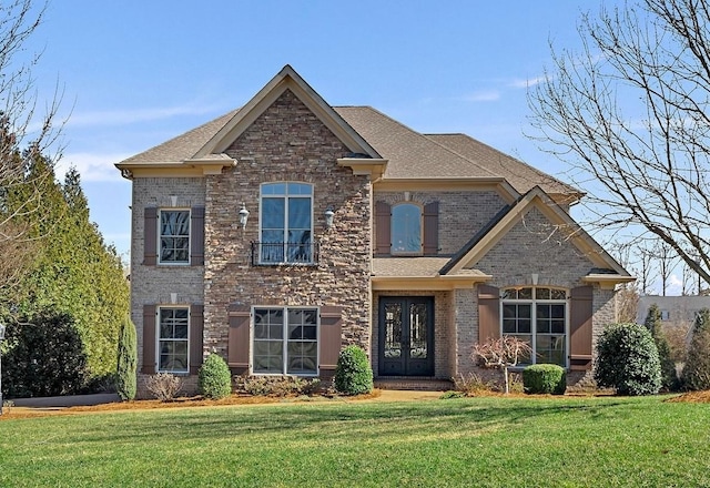 view of front of property with french doors and a front yard