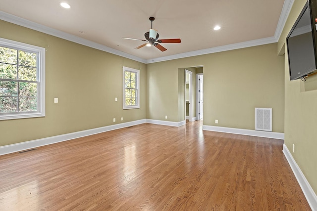 unfurnished room with ceiling fan, ornamental molding, and light hardwood / wood-style floors