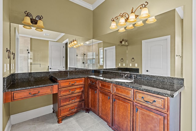 bathroom with crown molding, tile patterned flooring, vanity, and a tile shower