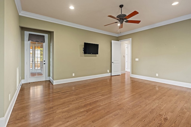 spare room with ceiling fan, light hardwood / wood-style flooring, and crown molding