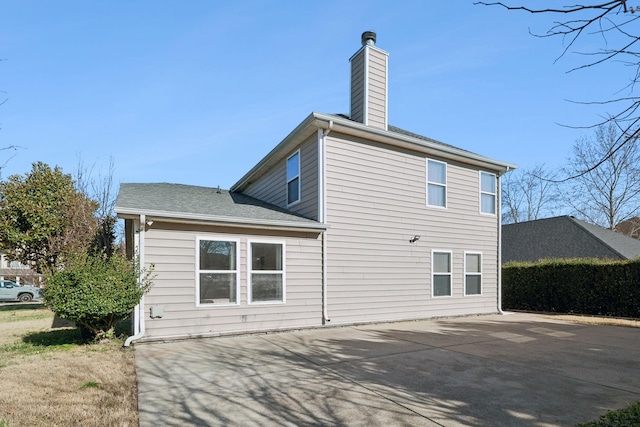 rear view of property featuring a patio area