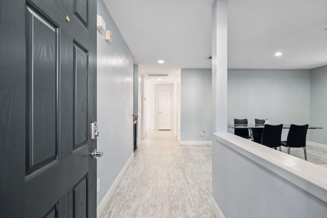 corridor featuring light hardwood / wood-style flooring