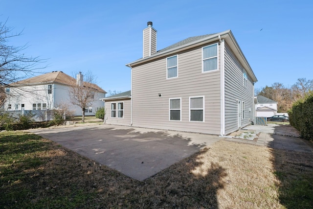 rear view of property featuring a patio area