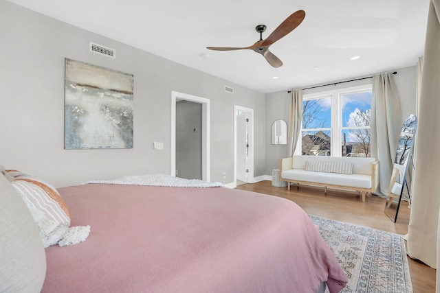 bedroom with hardwood / wood-style flooring and ceiling fan