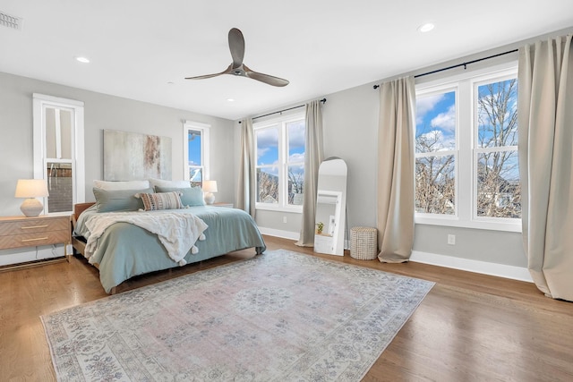 bedroom featuring ceiling fan and wood-type flooring