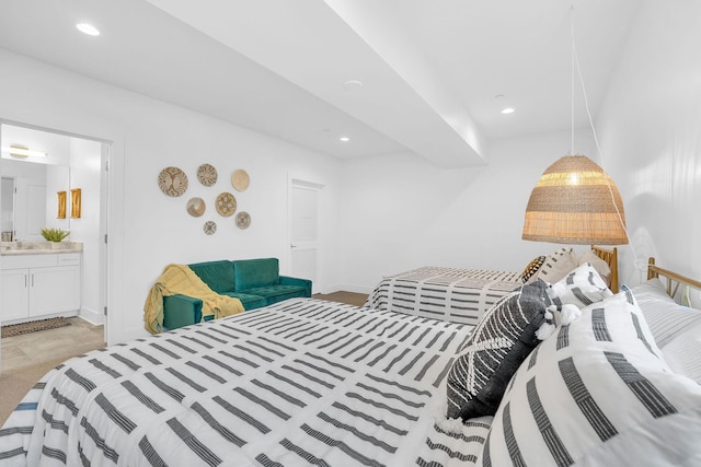 bedroom featuring sink and ensuite bathroom