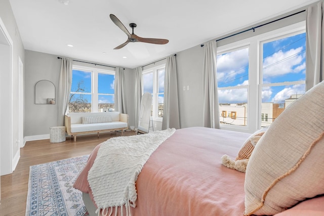 bedroom featuring light wood-type flooring, ceiling fan, and access to outside